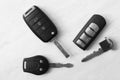 Flat lay composition with different car keys on light background Royalty Free Stock Photo