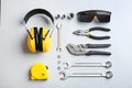 Flat lay composition with different construction tools on white