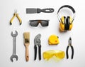 Flat lay composition with different construction tools on white