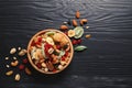 Flat lay composition of different dried fruits and nuts on color wooden background. Royalty Free Stock Photo