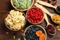 Flat lay composition with different dried fruits on wooden background Royalty Free Stock Photo