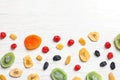 Flat lay composition with different dried fruits on wooden background, space for text. Healthy Royalty Free Stock Photo