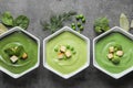 Flat lay composition with different fresh vegetable detox soups made of green peas, broccoli and spinach in dishes Royalty Free Stock Photo