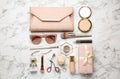 Flat lay composition with different luxury makeup products and accessories on white marble table Royalty Free Stock Photo