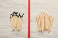 Flat lay composition with different matches on white wooden background. Racism concept Royalty Free Stock Photo