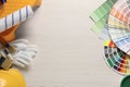 Flat lay composition with different painter\'s tools on white wooden table, space for text. Decorating and design Royalty Free Stock Photo