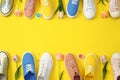 Flat lay composition with different sneakers and accessories on color background. Trendy spring look