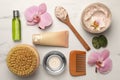 Flat lay composition with different spa products and flowers on white marble table Royalty Free Stock Photo