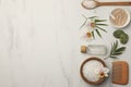 Flat lay composition with different spa products and flowers on white marble table. Space for text Royalty Free Stock Photo