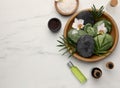 Flat lay composition with different spa products and flowers on white marble table. Space for text Royalty Free Stock Photo