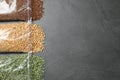 Flat lay composition with different types of legumes and cereals on dark grey table. Organic grains Royalty Free Stock Photo