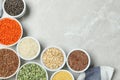 Flat lay composition with different types of legumes and cereals on grey marble table. Organic grains Royalty Free Stock Photo
