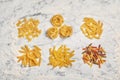 Flat lay composition with different uncooked pasta