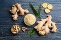 Flat lay composition with dry, fresh and capsuled ginger on blue wooden table