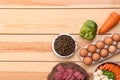 Flat lay composition with dry and natural dog food Royalty Free Stock Photo