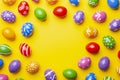 Flat lay composition with Easter eggs on color background. Frame made of decorated eggs. Top view with place for text Royalty Free Stock Photo