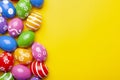 Flat lay composition with Easter eggs on color background. Frame made of decorated eggs. Top view with place for tetx Royalty Free Stock Photo