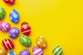 Flat lay composition with Easter eggs on color background. Frame made of decorated eggs. Top view with place for tex Royalty Free Stock Photo