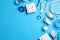 Flat lay composition with electrician`s accessories on light blue background, space for text Royalty Free Stock Photo