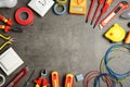 Flat lay composition with electrician`s tools and space for text Royalty Free Stock Photo