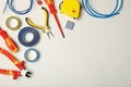 Flat lay composition with electrician`s tools and space for text Royalty Free Stock Photo