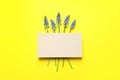 Flat lay composition with empty card and spring muscari flowers on color background Royalty Free Stock Photo