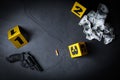 Flat lay composition with evidences and crime scene markers on black background Royalty Free Stock Photo