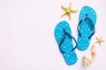 Flat lay composition with flip flops and seashell on colored background. Space for text top view Royalty Free Stock Photo