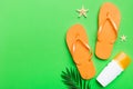 Flat lay composition with flip flops and seashell on colored background. Space for text top view Royalty Free Stock Photo