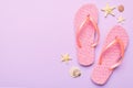 Flat lay composition with flip flops and seashell on colored background. Space for text top view Royalty Free Stock Photo