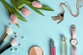 Flat lay composition with flowers and different beauty accessories on color background