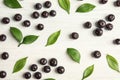 Flat lay composition with fresh acai berries and leaves Royalty Free Stock Photo