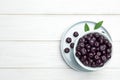 Flat lay composition with fresh acai berries on white wooden table Royalty Free Stock Photo