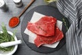 Flat lay composition with fresh beef cut on table