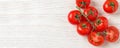Flat lay composition with fresh cherry tomatoes on wooden table, space for text. Banner design Royalty Free Stock Photo
