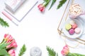 Flat lay composition with fresh flowers, tray, coffee and macaroons. Lifestyle concept frame. Royalty Free Stock Photo