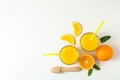 Flat lay composition with fresh orange juices, wooden juicer, mint, oranges and wooden juicer on white background Royalty Free Stock Photo