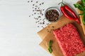 Flat lay composition with fresh raw minced meat on white wooden table Royalty Free Stock Photo