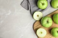 Flat lay composition of fresh ripe green apples on grey stone table Royalty Free Stock Photo