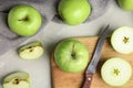 Flat lay composition of fresh ripe green apples on stone table Royalty Free Stock Photo