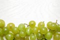 Flat lay composition with fresh ripe juicy grapes on white wooden table Royalty Free Stock Photo