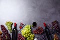 Flat lay composition with fresh ripe juicy grapes and wine on grey table Royalty Free Stock Photo