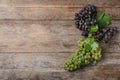 Flat lay composition with fresh ripe juicy grapes on wooden table Royalty Free Stock Photo
