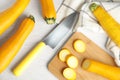 Flat lay composition with fresh ripe yellow zucchinis on wooden table