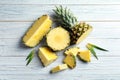 Flat lay composition with fresh sliced pineapple wooden background Royalty Free Stock Photo