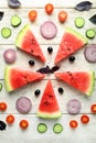 Flat lay composition with fresh watermelon and vegetables on wooden background Royalty Free Stock Photo