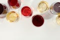 Flat lay composition. Glasses with different wine on white background Royalty Free Stock Photo