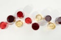 Flat lay composition. Glasses with different wine on white background Royalty Free Stock Photo