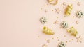 Flat lay composition with golden serpentine, party streamers, confetti stars on beige table. Top view with copy space. Invitation Royalty Free Stock Photo