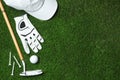 Flat lay composition with golf equipment on artificial grass